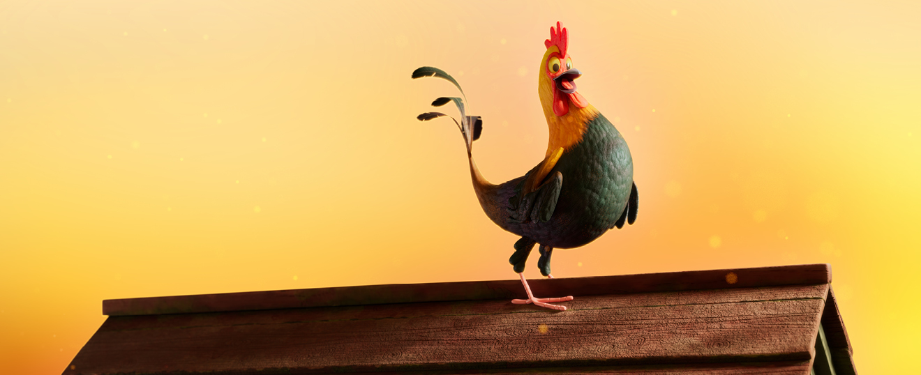 Cockerel standing on a roof