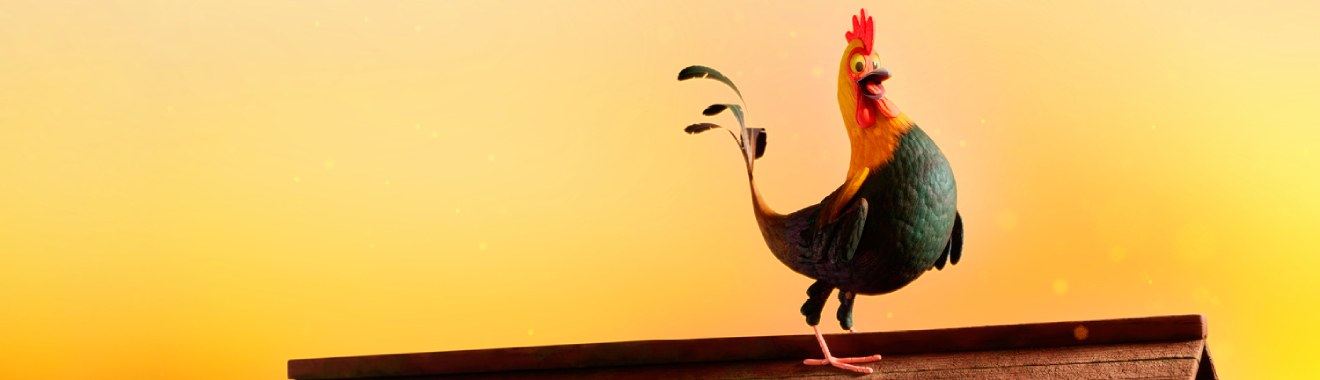 Cockerel standing on a roof