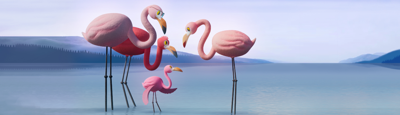 flamingo family standing together in water with mountains in the background